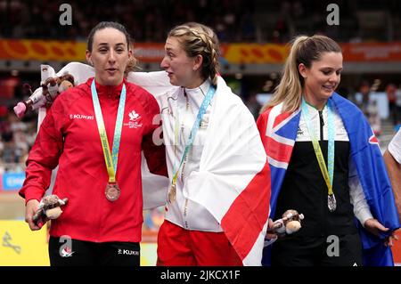 England's Laura Kenny (centre) celebrates with her gold medal, alongside New Zealand's Michaela Drummond (right) with silver and Canada's Maggie Coles-Lyster with bronze after winning the Women's 10km Scratch Race Finals at Lee Valley VeloPark on day four of the 2022 Commonwealth Games in London. Picture date: Monday August 1, 2022. Stock Photo