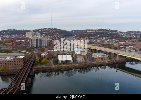 Aerial view of Pittsburgh, Pennsylvania's North Side, taken over the Allegheny River near North Shore and Troy Hill. Veterans Bridge (I-579) is on the Stock Photo