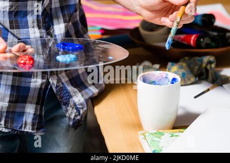 artist paints palette artwork idea hobby therapy Stock Photo