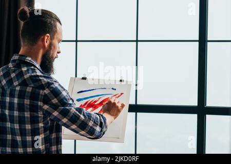 creative hobby inspired young artist painting Stock Photo