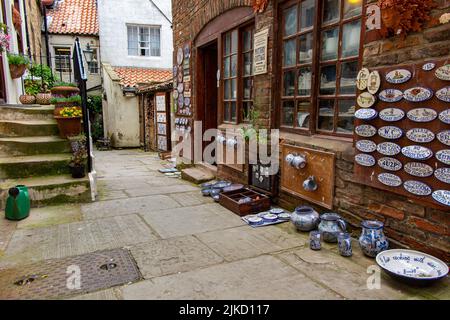 A pottery business in the narrow streets in Whitby, a popular holiday destination in Yorkshire Stock Photo