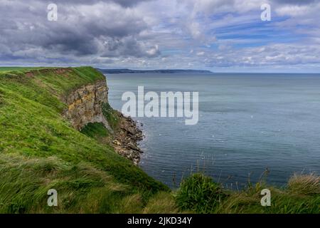 View from the clifftops near Filey Brigg looking north towards Scarborough Stock Photo