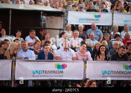 Odessa, Ukraine August 11, 2019: Many spectators at concert. crowd of visitors to concert has fun and shoots what is happening on smartphones. Fans at Stock Photo