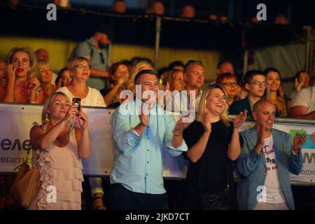 Odessa, Ukraine August 11, 2019: Many spectators at concert. crowd of visitors to concert has fun and shoots what is happening on smartphones. Fans at Stock Photo