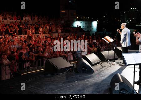 Odessa, Ukraine August 11, 2019: Many spectators at concert. crowd of visitors to concert has fun and shoots what is happening on smartphones. Fans at Stock Photo