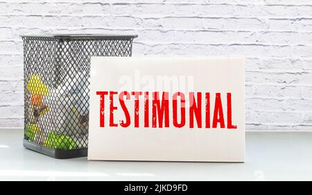 Client testimonials text concept write on notebook with pen Stock Photo