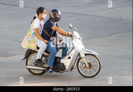 SAMUT PRAKAN, THAILAND, MAY 26 2022, The pair rides on motorcycle at the street. Stock Photo
