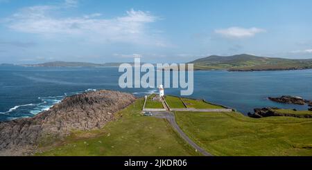 A landscape view of Gubbacashel Point at the entrance of Broadhaven Bay with the historic Ballyglass Lighthouse Stock Photo