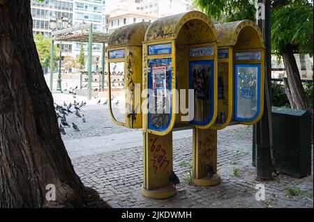 ATHENS, GREECE - MAY 14, 2022: City payphones on Agiou Konstantinou Street in Athens, Greece Stock Photo