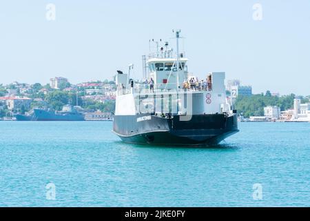 RUSSIA, CRIMEA - JUL 08, 2022: Sevastopol city bay crimea sea russia pier ferry transport people, for landscape black in view for transportation Stock Photo