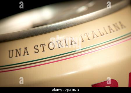 An Italian Story text on Birra Moretti Italian beer can close up detail on black Stock Photo