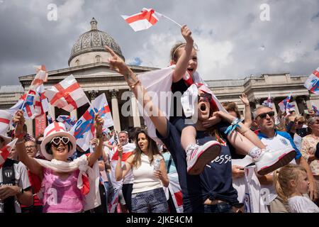 The day after the England Womens's Football team victory in the Euro 2022 tournament, in which they beat Germany 2-1 in extra time, English fans celebrate in Trafalgar Square, on 1st August 2022, in London, England. The free event was staged by the English Football Association where the winning women players (aka The Lionesses) appeared on stage in front of an adoring public consisting of families, parents, children and especially aspiring young women footballers of the future. (Photo by Richard Baker / In Pictures via Getty Images) Stock Photo