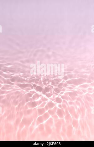 Serum or water texture close up. Light purple and pink gradient water background. Transparent beauty skincare sample. Cosmetic clear liquid smudge Stock Photo