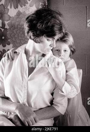 1960s WOMAN MOTHER SITTING IN CHAIR HEAD TURNED DOWN TOWARDS YOUNG GIRL DAUGHTER WITH SAD EXPRESSION HUGGING HER FROM BEHIND - j13601 HAR001 HARS SUBURBAN URBAN DEPRESSION HER MOTHERS EXPRESSION OLD TIME NOSTALGIA HUGGING OLD FASHION 1 JUVENILE FACIAL YOUNG ADULT SAFETY EMBRACE WORRY STRONG FAMILIES LIFESTYLE FEMALES MOODY HEALTHINESS HOME LIFE HALF-LENGTH HUG LADIES DAUGHTERS PERSONS CARING RISK TOWARDS EMBRACING EXPRESSIONS TROUBLED B&W CONCERNED SADNESS WELLNESS HIGH ANGLE STRENGTH FEELING MOOD TURNED UNSURE CONCEPTUAL GLUM SUPPORT PERSONAL ATTACHMENT AFFECTION EMOTION EMOTIONAL EMOTIONS Stock Photo