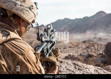A U.S. Marine with Charley Company, 1st Battalion, 7th Marine Regiment, 1st Marine Division, fires an M320 Grenade Launcher while executing Range 400 during Integrated Training Exercise 4-22 at Marine Corps Air Ground Combat Center, Twentynine Palms, Calif., July 25, 2022. Active duty units, including Charley Company, 1/7, and Marines from 10th Marine Regiment, are fully integrated with Marine Air-Ground Task Force 23 as the Reserve and Active Components continue to work together to increase proficiency of Total Force operations. (U.S. Marine Corps photo by Lance Cpl. David Intriago)
