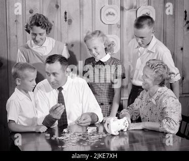 1950s MOTHER FATHER COUNTING MONEY FROM PIGGY BANK AND TEACHING SONS AND DAUGHTERS THE VALUE AND TYPES OF MONEY COINS BILLS - j3383 HAR001 HARS PAIR 4 COINS MOTHERS OLD TIME TEACHING NOSTALGIA BROTHER OLD FASHION SISTER 1 JUVENILE COUNTING SONS FAMILIES FEMALES MARRIED BROTHERS SPOUSE HUSBANDS 6 LADIES DAUGHTERS PERSONS MALES TEENAGE GIRL SIX TEENAGE BOY SIBLINGS SISTERS FATHERS B&W PARTNER AND DADS SIBLING VALUE FISCAL RESPONSIBILITY TEENAGED TYPES JUVENILES MID-ADULT MID-ADULT MAN MID-ADULT WOMAN MOMS PRE-TEEN PRE-TEEN GIRL WIVES BLACK AND WHITE CAUCASIAN ETHNICITY HAR001 OLD FASHIONED Stock Photo