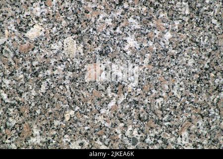 The photo shows gray and white granite. Can be used as background Stock Photo