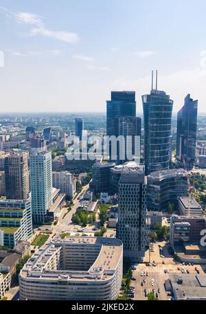 7.22.2022 Warsaw, Poland. Vertical outdoor aerial shot showing various skyscrapers and other tall buildings in the centre of Warsaw. Holiday destination for city lovers. High quality photo Stock Photo