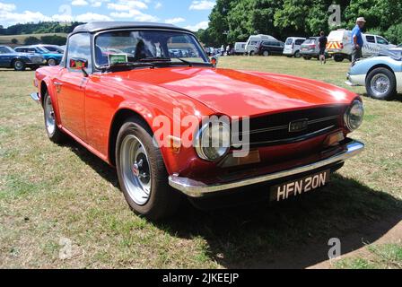 A 1975 Triumph TR6 parked on display at the 47th Historic Vehicle Gathering classic car show, Powderham, Devon, England, UK. Stock Photo