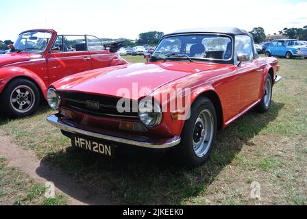 A 1975 Triumph TR6 parked on display at the 47th Historic Vehicle Gathering classic car show, Powderham, Devon, England, UK. Stock Photo