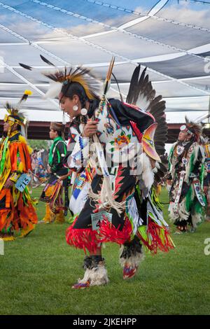 Grass dancer dressed in colorful outfit dances at the Shoshone Bannock Pow Wow, Fort Hall Idaho Stock Photo