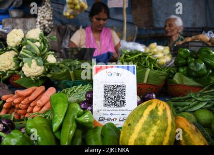 Mumbai, India. 01st Aug, 2022. A Unified Payment Interface (UPI) barcode is kept at a vegetable stall for customers to make digital payment in Mumbai. Unified Payment Interface (UPI) recorded over 6,000,000,000 (six billion) transaction in the month of July in India which is the highest ever by a digital payment platform since it started in the year 2016. (Photo by Ashish Vaishnav/SOPA Images/Sipa USA) Credit: Sipa USA/Alamy Live News Stock Photo