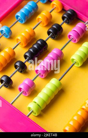 close-up of colorful abacus or counting frame, multicolored background for designing, mathematics and calculating toy, learning and educational Stock Photo
