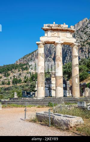 Delphi Greece, Archaeological Site. Ancient Greek temple stone and columns ruins, blue sky background Stock Photo