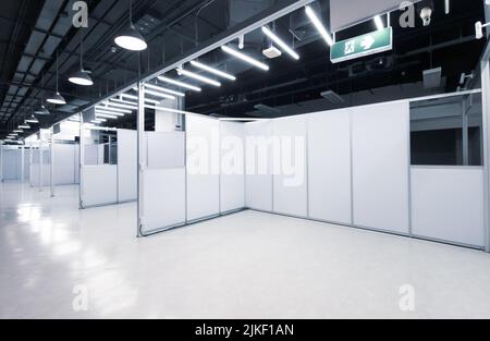 Trade show interior with empty booth inside the business trade show pavilion. Stock Photo