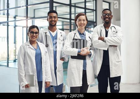 A dedicated team of experts. a group of medical staff together at work. Stock Photo