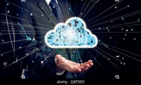 Businessman show hologram of cloud computing network allusive technology. Virtual augmented reality generated by 3D rendering motion graphic and Stock Photo