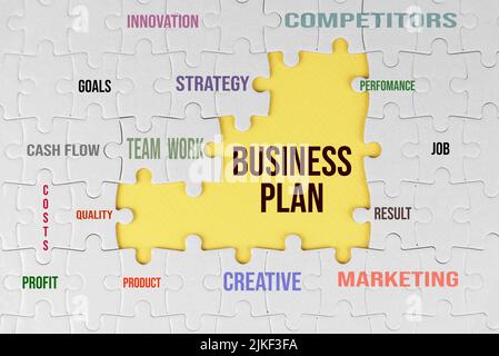 Business plan puzzle. White jigsaw puzzle with some missing pieces on soft yellow. Success business plans concept. Stock Photo