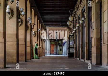 Pamplona, Spain - June 21, 2021: Arched colonnade by the historic Iruna cafe, frequented by Ernest Hemingway on Plaza del Castillo square in Old Town Stock Photo