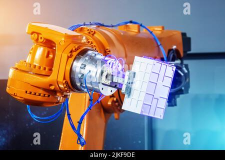 Automated hand robot technical production, measurement, study of the parameters of objects. Industrial techno theme Stock Photo