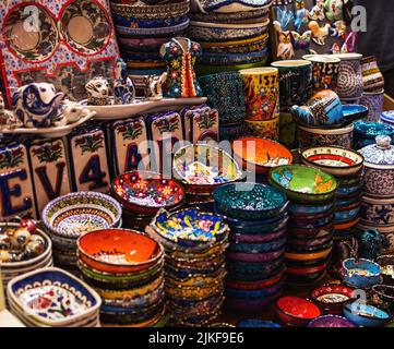 Collection of turkish ceramics on sale at the Grand Bazaar in Istanbul, Turkey. Turkish colorful ornamental ceramic souvenir. Stock Photo