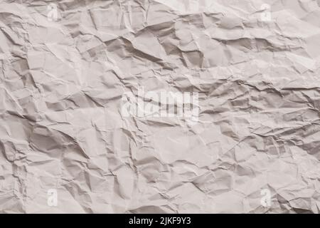 beige wrinkled paper waste recycling background Stock Photo