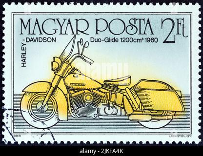 HUNGARY - CIRCA 1985: A stamp printed in Hungary from the 'Centenary of Motorcycle' issue shows Harley Davidson Duo-Glide 1200, 1960. Stock Photo