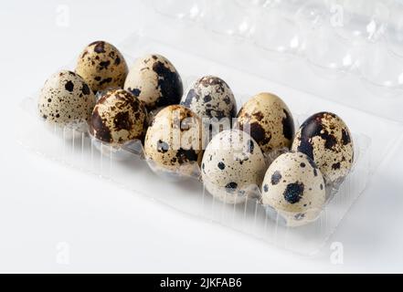 Quail eggs in a pack placed on a white background Stock Photo