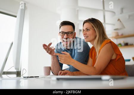 Programmers cooperating at IT company developing apps Stock Photo