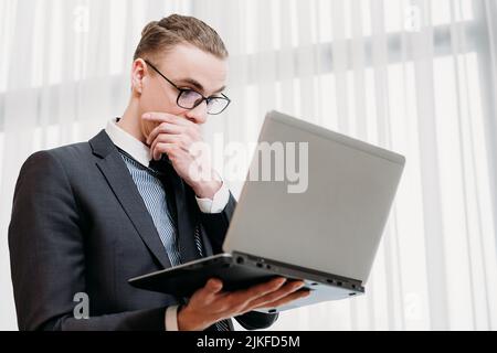 business problem bad news focused man look laptop Stock Photo