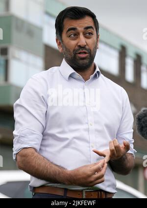 File photo dated 12/05/22 of Health Secretary Humza Yousaf as he speaks to the media during a visit to Falkirk Community Hospital to announce additional funding to develop the Hospital at Home scheme. Mr Yousaf branded comments from Liz Truss about First Minister Nicola Sturgeon 'petty jibes', but warned that the Tory leadership hopeful is carrying out an 'all-out assault on devolution'. ' Stating that all UK Government policy should apply in Scotland, from the party that hasn't ruled out including the NHS in future trade deals, should concern us all,' he said. Issue date: Tuesday August 2, 20 Stock Photo