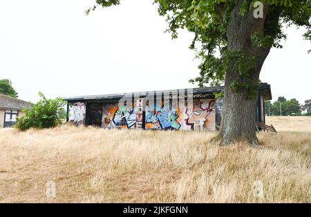 Brighton UK 2nd August 2022 - The grass is bone dry and parched around Hove Rugby Club as the dry warm weather is forecast to continue in the South East over the next few days : Credit Simon Dack / Alamy Live News Stock Photo