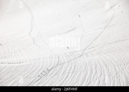 Skiers descending from the summit of Aiguille du Midi in Mont Blanc ...