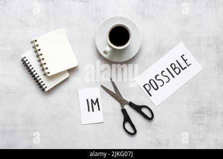 Word Impossible becomes Possible. Motivation concept Stock Photo