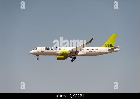 18.06.2022, Germany, Berlin, Berlin - Europe - An Air Baltic Airbus A220-300 passenger aircraft with registration YL-AAT on approach to Berlin Branden Stock Photo
