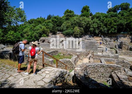 27.06.2022, Albania, Ksamil, Butrint - Tourists visiting the amphitheater in ancient Butrint, Temple of Asklepios and theater, World Heritage Ruined C Stock Photo