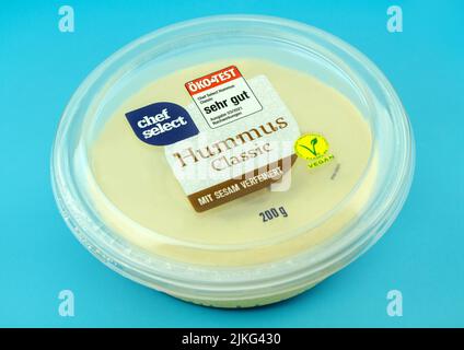 Homous Labels Hummus with German Label on blue background Stock Photo - Alamy