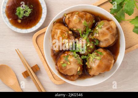 Bawan (Ba wan), Taiwanese meatball delicacy, delicious street food, steamed starch wrapped round shaped dumpling with pork and shrimp inside and thick Stock Photo