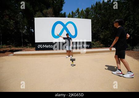 Menlo Park, United States. 01st Aug, 2022. People take photos outside the headquarters of Meta. Meta is one of the strongest companies in the United States even the whole world. There are plenty of social medias that Meta owns, includes Facebook, Instagram, and WhatsApp. The headquarters of Meta is located in Menlo Park, a city in California. Some tourists come to the headquarters of Meta to take photos. Credit: SOPA Images Limited/Alamy Live News Stock Photo