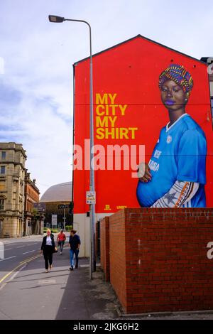 The My City, My Shirt mural in Butetown, Cardiff. Has been repainted in a new location after the previous site was painted over to accommodate a McDon Stock Photo